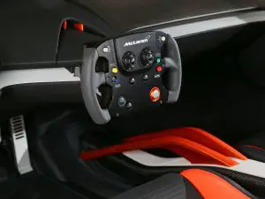 the-car-comes-with-a-steering-wheel-that-looks-like-a-video-game-controller-the-wheel-can-be-used-to-controla-heads-up-display-while-in-motion